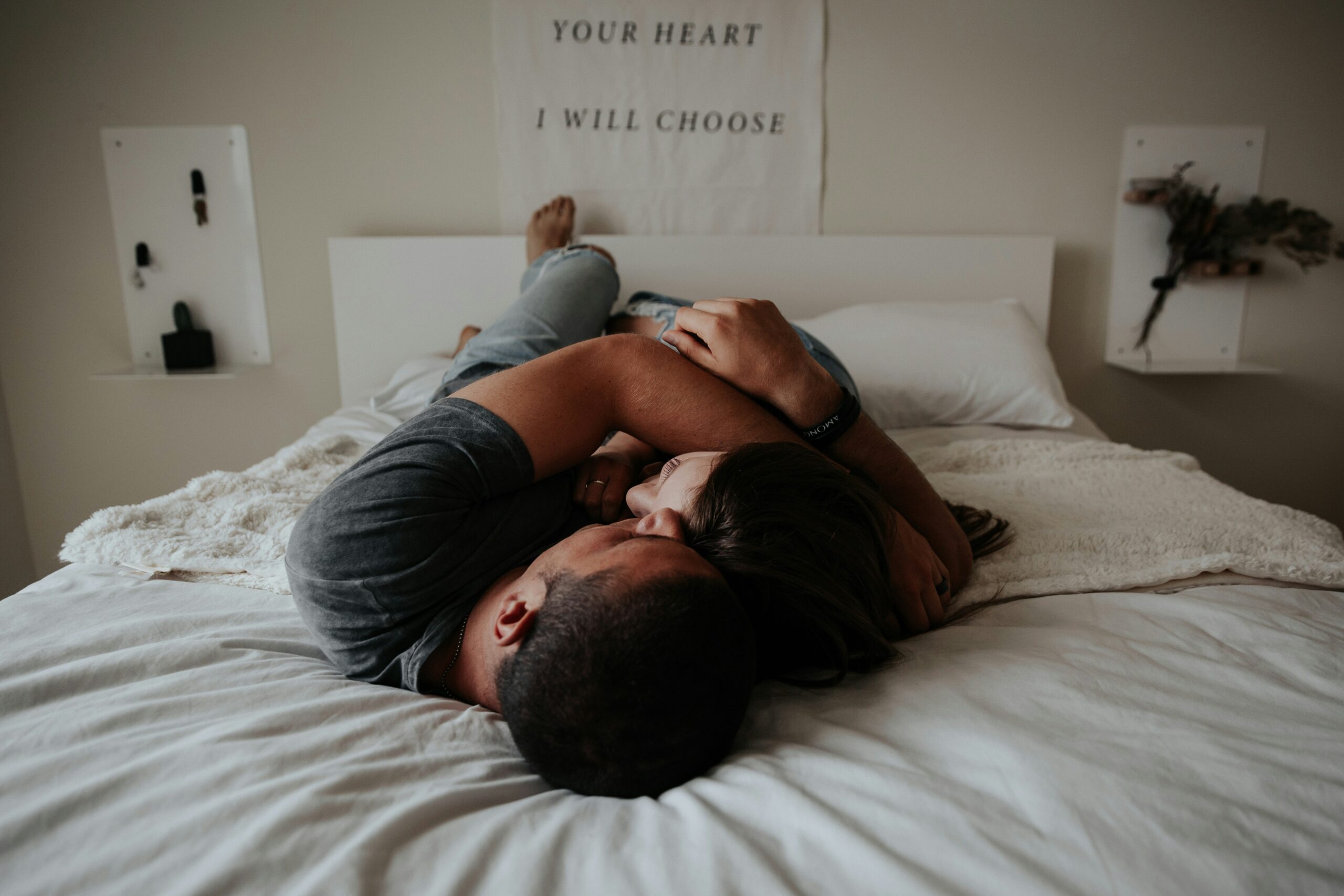 a man and a woman couple lying in bed